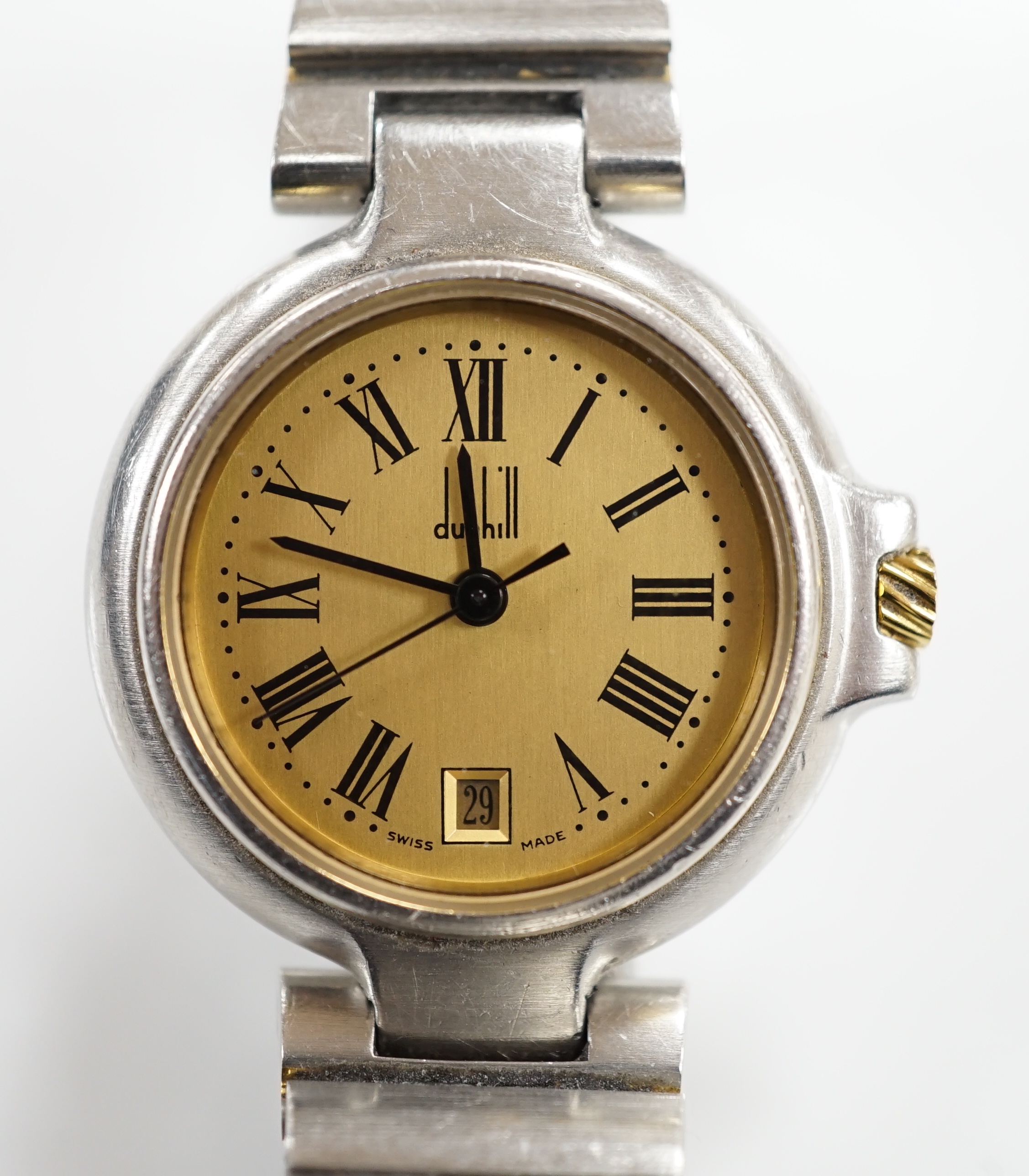 A lady's 1970's stainless steel Dunhill quartz wrist watch, with centre seconds and date aperture with box and papers.